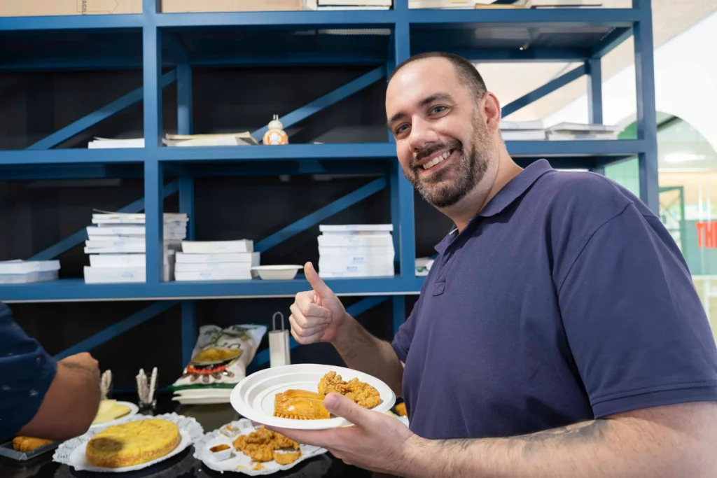 Another WATA Factory employee proudly showing his plate of food from the All Hands buffet.